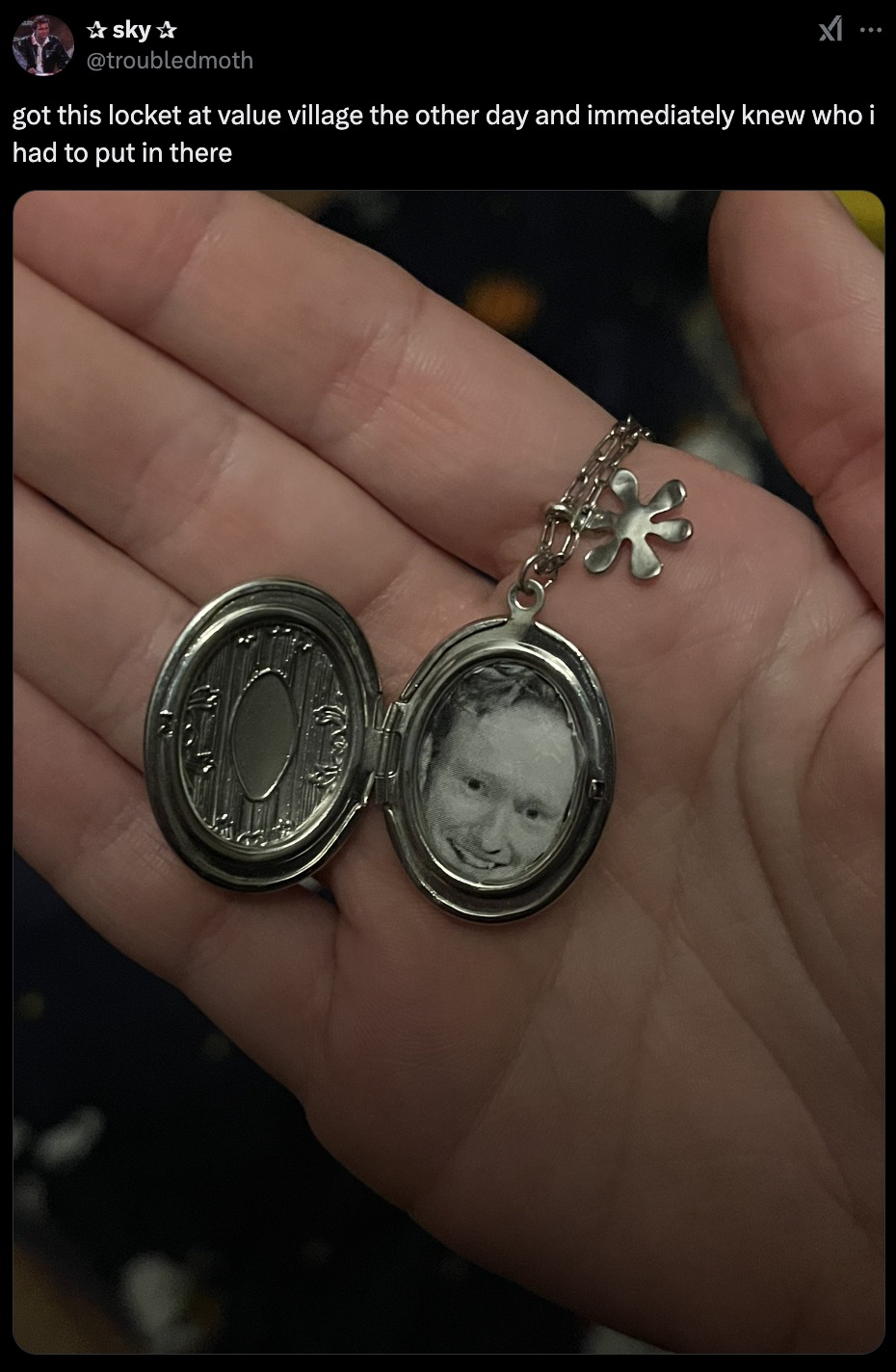 silver - sky got this locket at value village the other day and immediately knew who i had to put in there